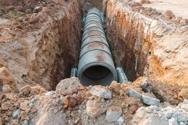 Concrete drainage pipe on a construction site Premium Photo